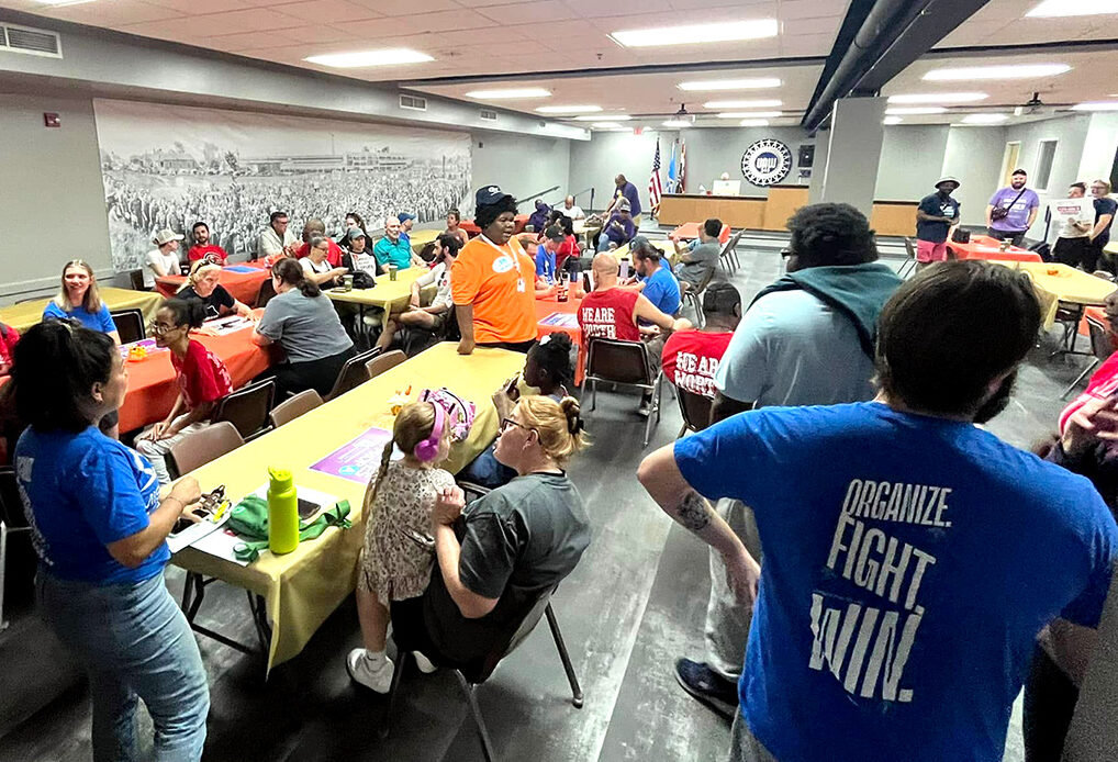 Members of an organization gather to strategize and align on upcoming campaigns.